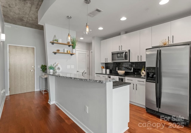 kitchen with open shelves, stainless steel appliances, visible vents, decorative backsplash, and dark wood-type flooring