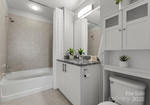 bathroom featuring tile patterned flooring, shower / bath combo, vanity, and toilet