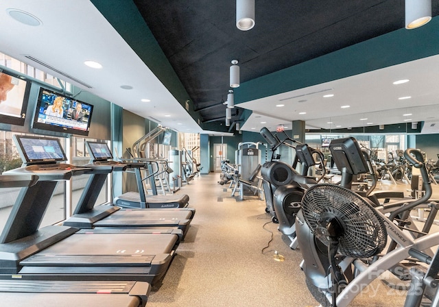 workout area featuring recessed lighting