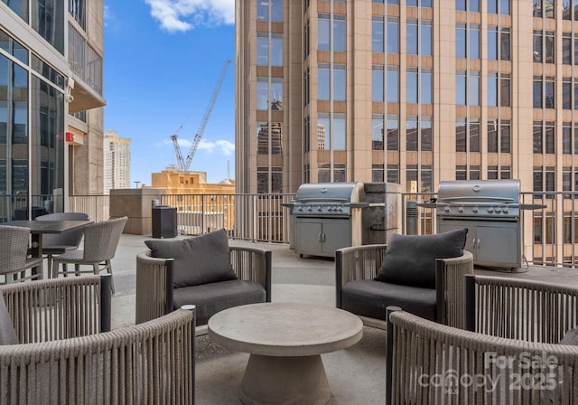 view of patio / terrace with outdoor lounge area, area for grilling, and a balcony