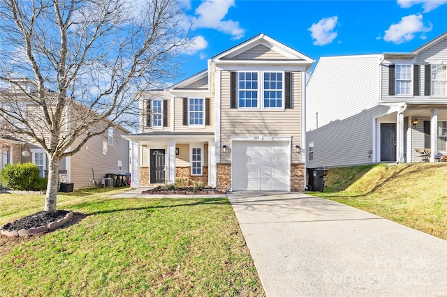 view of front facade featuring driveway, a garage, central AC unit, and a front yard