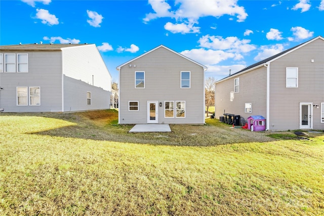 back of house with a yard and a patio area