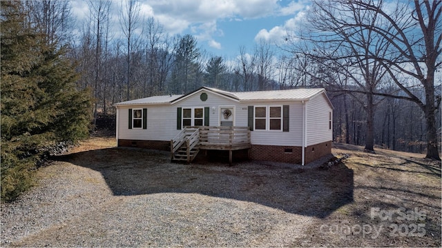 manufactured / mobile home with crawl space and metal roof