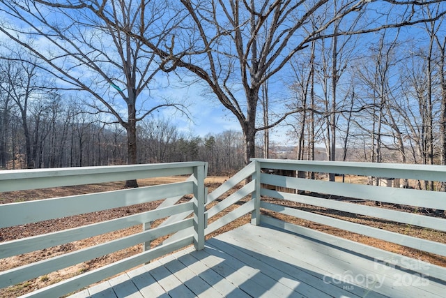 deck featuring a view of trees