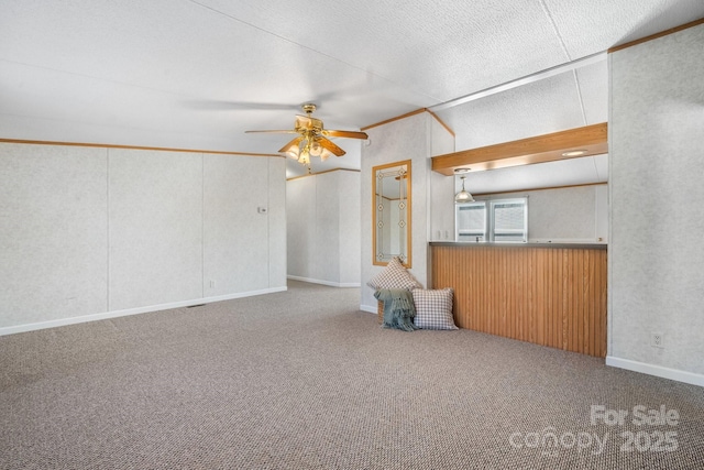 unfurnished living room with carpet, ceiling fan, and a textured ceiling