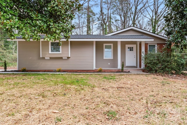 5329 Southampton Rd, Charlotte, NC 28217 - ranch-style house with covered porch and a front lawn