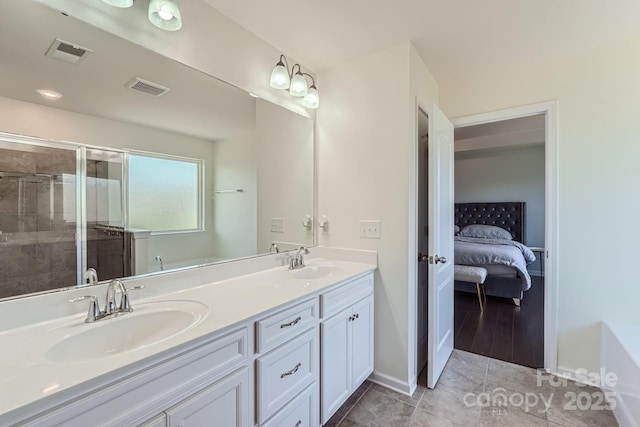 full bath with a sink, visible vents, and a shower stall