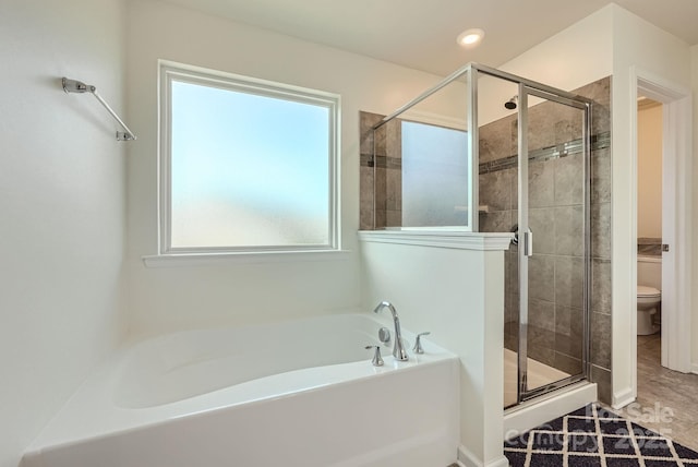 bathroom featuring recessed lighting, a garden tub, a shower stall, and toilet