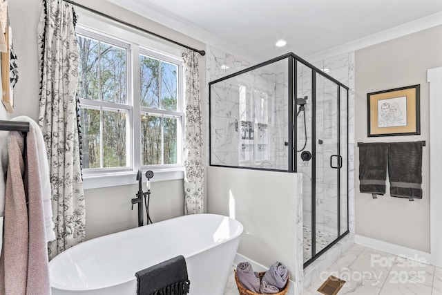 full bathroom featuring a stall shower, marble finish floor, visible vents, and a freestanding tub