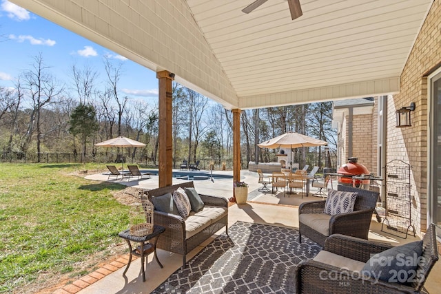 view of patio / terrace featuring outdoor dining area, a fenced backyard, an outdoor hangout area, a ceiling fan, and an outdoor pool