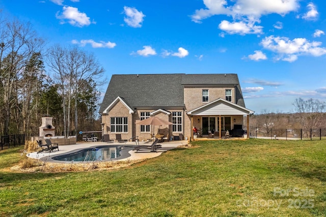 rear view of property with a patio, a fireplace, and a fenced backyard