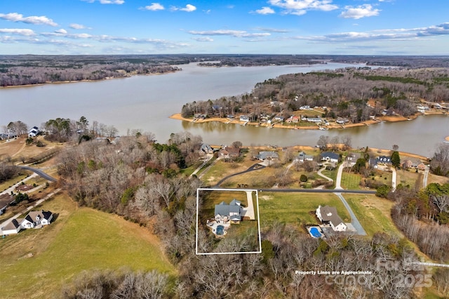 birds eye view of property with a water view