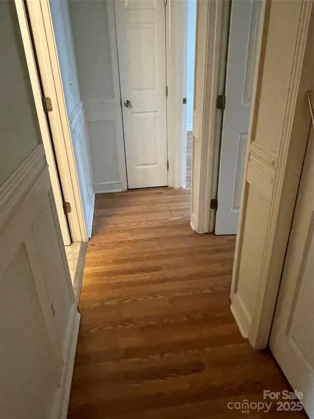 corridor featuring light wood-style flooring