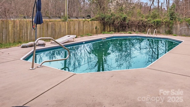 view of pool with a patio area, a fenced in pool, and a fenced backyard