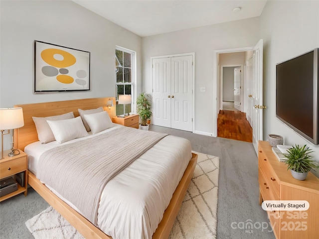 bedroom with a closet and carpet