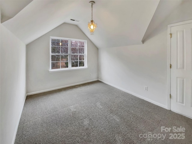 bonus room with lofted ceiling, carpet, visible vents, and baseboards