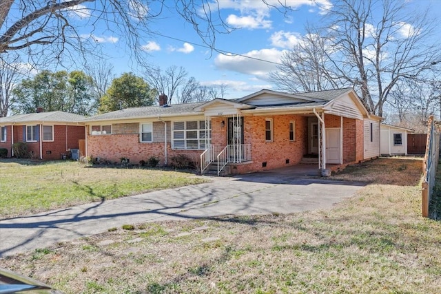 single story home featuring brick siding, concrete driveway, a chimney, crawl space, and a front yard