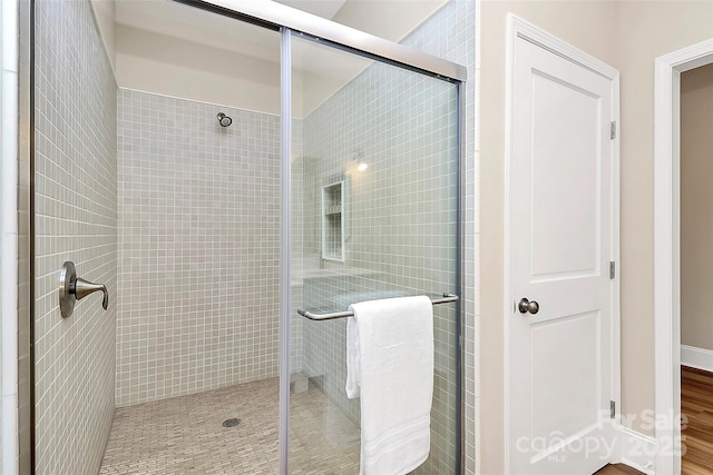 bathroom featuring a stall shower