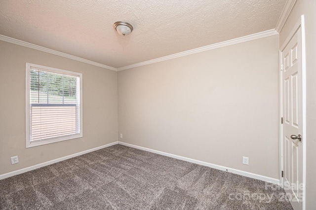 carpeted spare room featuring baseboards, ornamental molding, and a textured ceiling