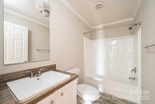 bathroom featuring visible vents, toilet, tub / shower combination, a textured ceiling, and vanity