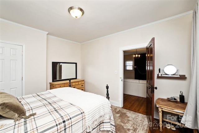 bedroom with ornamental molding, a chandelier, baseboards, and wood finished floors