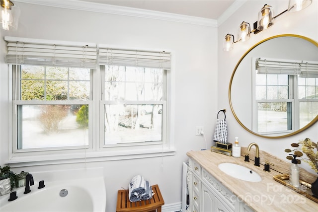 full bathroom featuring ornamental molding, a tub, and vanity