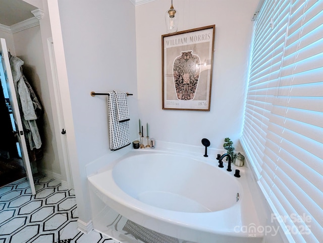 full bath with a garden tub and crown molding