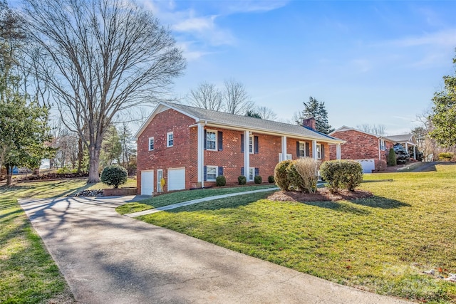 view of front of home featuring a garage, brick siding, concrete driveway, a chimney, and a front yard