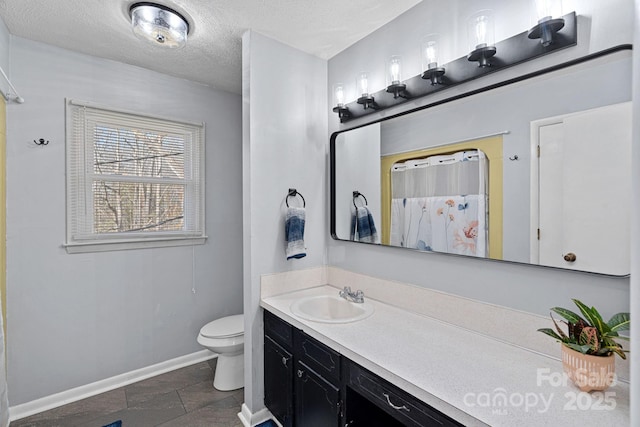 bathroom with a textured ceiling, toilet, vanity, baseboards, and a shower with curtain