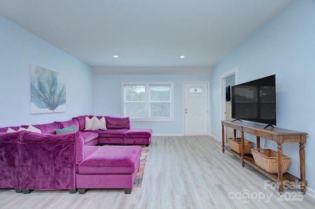 living area featuring recessed lighting, wood finished floors, and baseboards