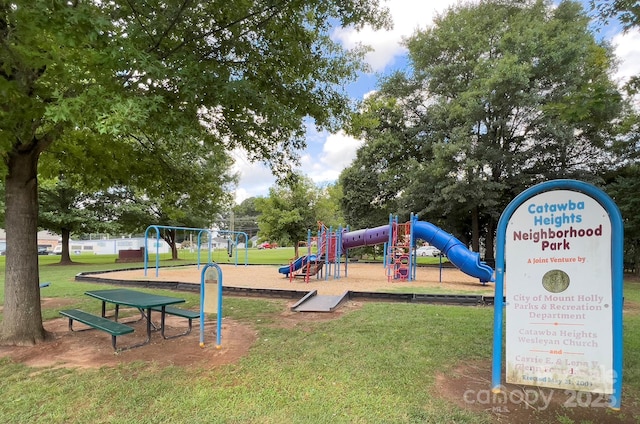 community playground featuring a lawn