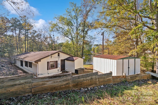 exterior space with a storage unit and an outdoor structure