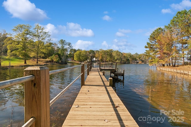 dock area featuring a water view