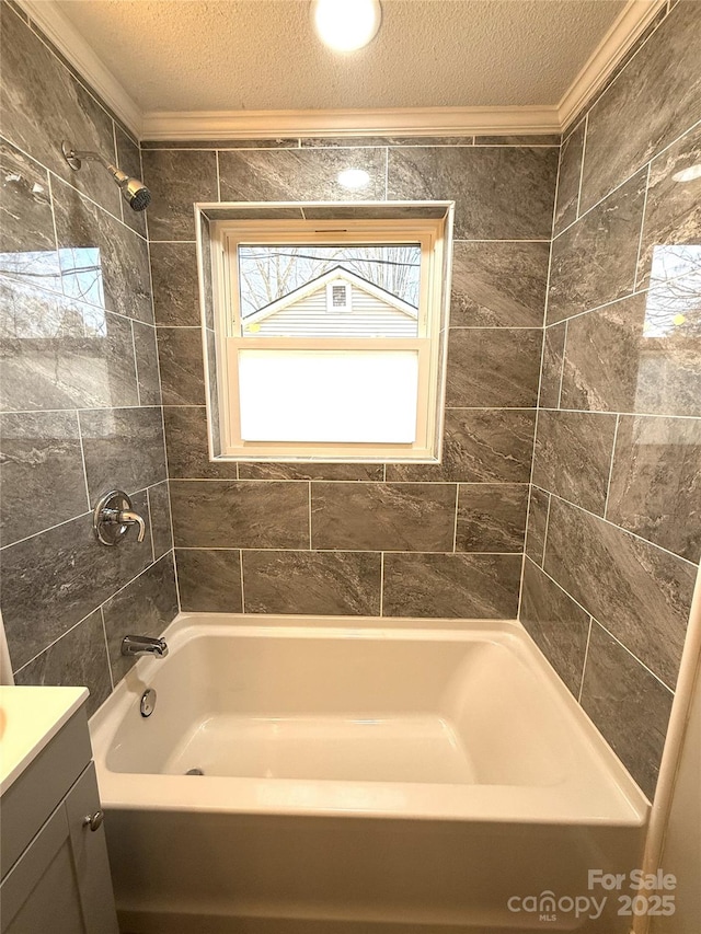 full bathroom featuring crown molding, a textured ceiling, and vanity