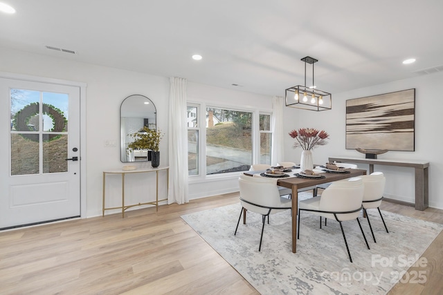 dining area featuring light wood-style floors, visible vents, and recessed lighting