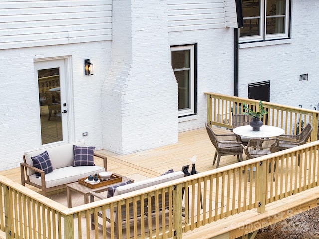 deck featuring an outdoor living space