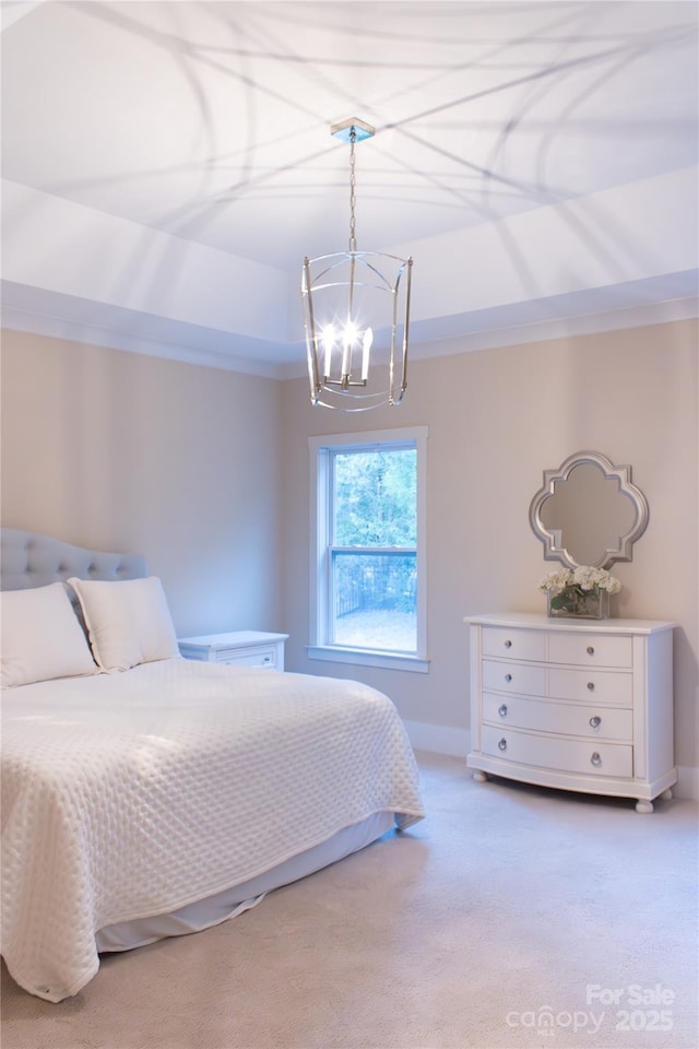 bedroom featuring a tray ceiling, a notable chandelier, light colored carpet, ornamental molding, and baseboards