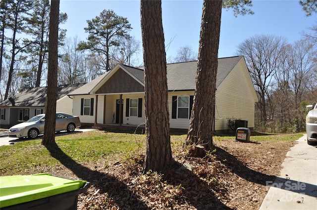 view of front of home with covered porch and central AC unit