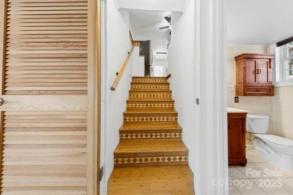 stairs with wood finished floors