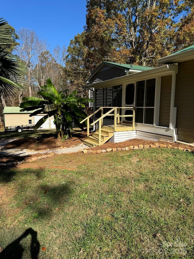 view of yard with a sunroom