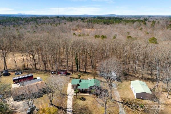 birds eye view of property with a rural view