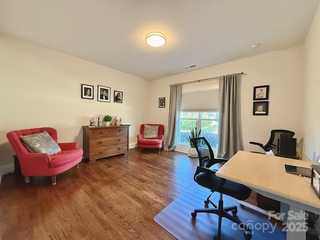 office area with wood finished floors and visible vents