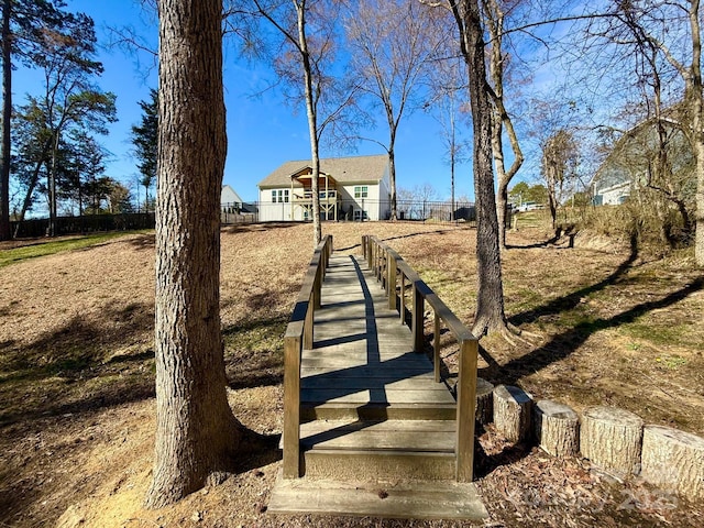 view of community with fence