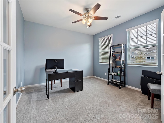 office with carpet floors, visible vents, baseboards, and a ceiling fan