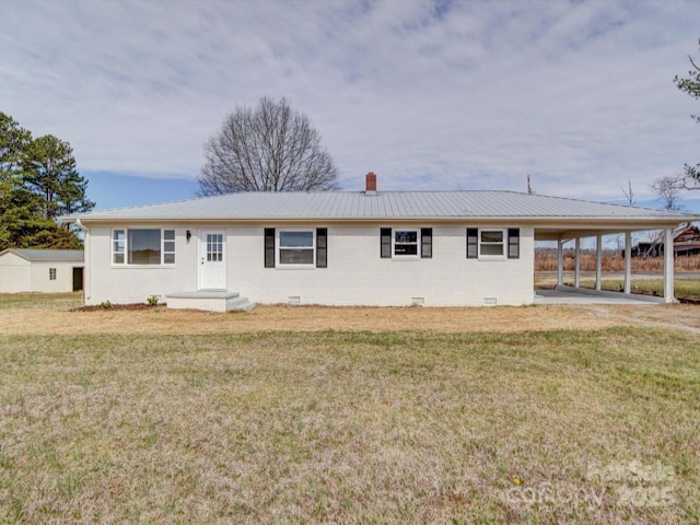 ranch-style home with crawl space, a front lawn, a carport, and brick siding