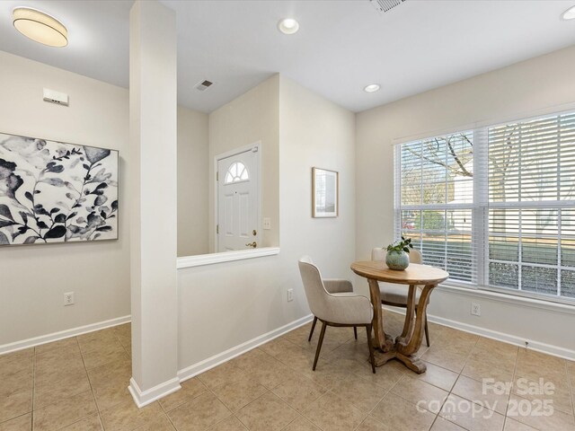 dining room featuring visible vents, baseboards, and light tile patterned flooring