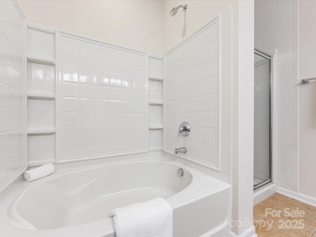 full bath featuring tile patterned floors, a bathing tub, and a shower with shower door