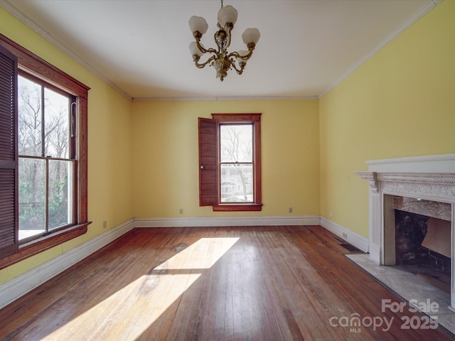 unfurnished living room with hardwood / wood-style floors and a wealth of natural light