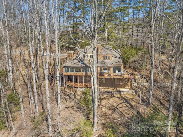 rear view of house with a wooden deck