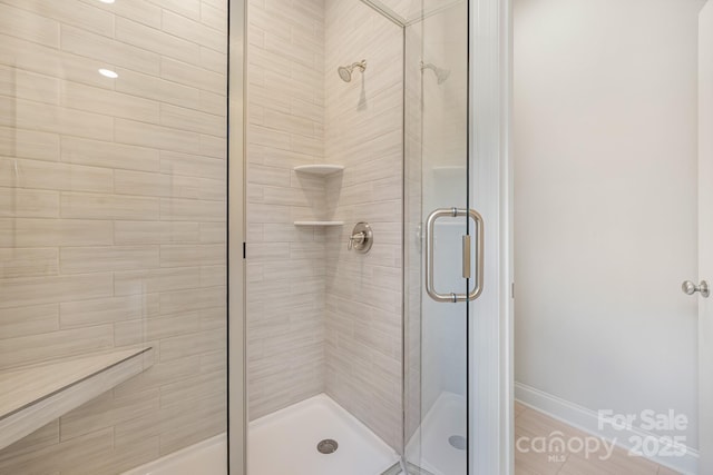 bathroom featuring a shower stall